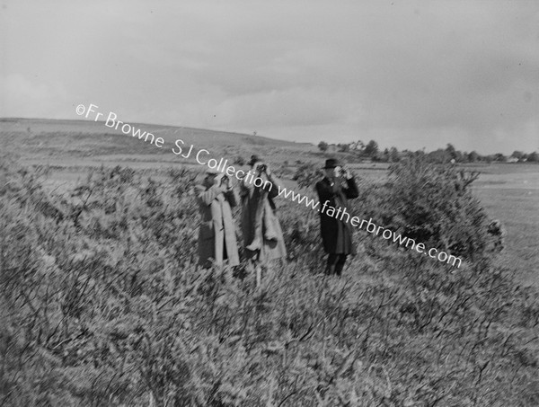 FR.P.G.KENNEDY S.J. PHOTOGRAPHING RED-NECKED PHALAROPE